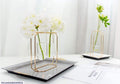 Elegant Golden Metal Frame Glass Vase Stand for Tabletop & Gifting  Best for targeting decor accent buyers and gift shoppers.