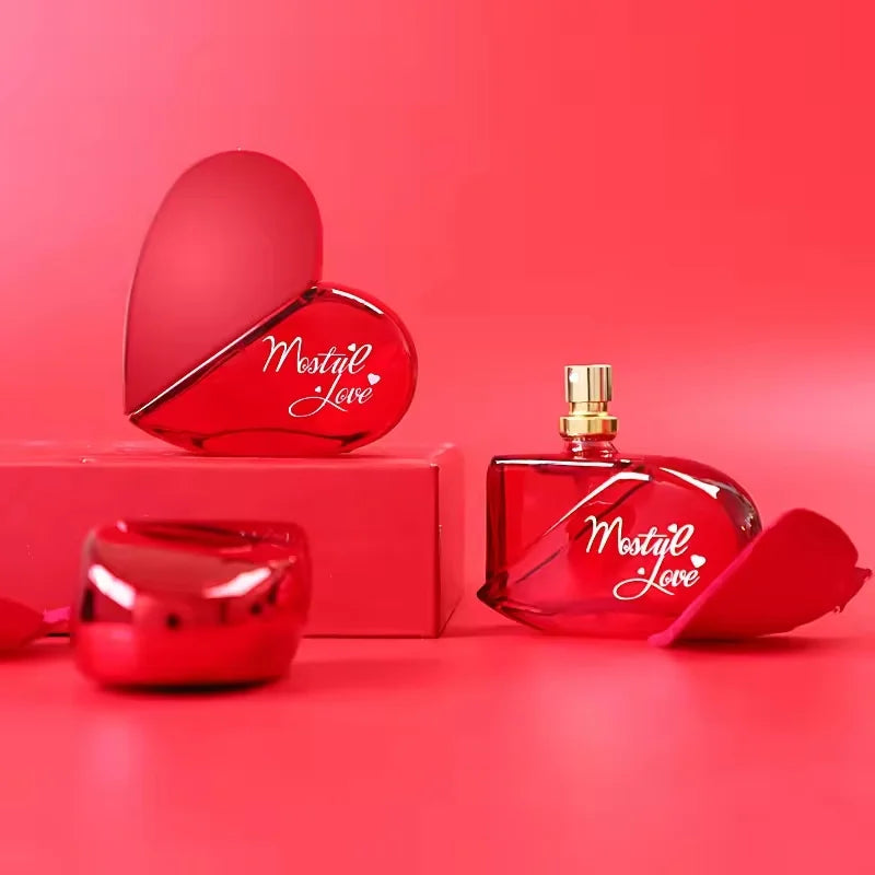 Mutual Love Perfume for Women 50ml displayed with a heart-shaped bottle on a vibrant red background.